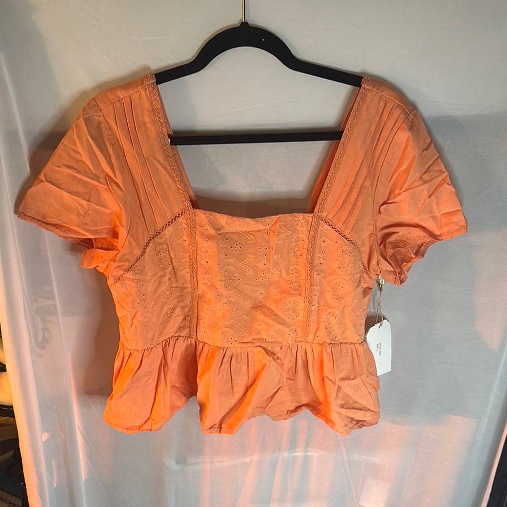 Elegant Orange Blouse with Chic Design